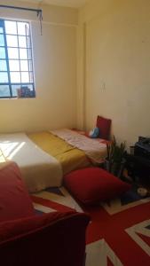 Ένα ή περισσότερα κρεβάτια σε δωμάτιο στο Lily Homes