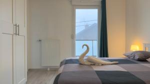 En eller flere senge i et værelse på Le Mignon - T2 - 4 personnes - Combe Persil