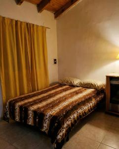 Giường trong phòng chung tại Casa Cafa