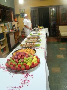 a buffet line with many different types of food at Pousada Y-Goá in Bertioga