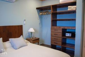 Ένα ή περισσότερα κρεβάτια σε δωμάτιο στο Taruca Apart