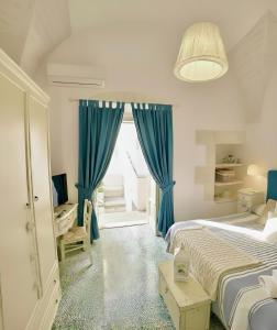 Ένα ή περισσότερα κρεβάτια σε δωμάτιο στο Casa Agrumeto 28