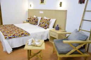 Postel nebo postele na pokoji v ubytování King baobab lodge + 41 fotografií