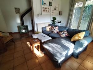 a living room with a couch and a table at Mes Maisons - Holiday Villa in Drome Provencale - Villa Bellevue Venterol 26110 in Venterol