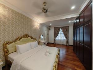 Кровать или кровати в номере 5Bedroom Grande Villa PJ 6