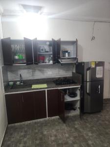 Kuchyň nebo kuchyňský kout v ubytování Apartamento Acogedor - San Luis, Ant - Shelter La Perla Hostal + 14 fotografií