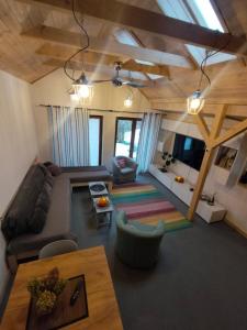 a living room with a couch and a table at Wolna Chwila in Maków