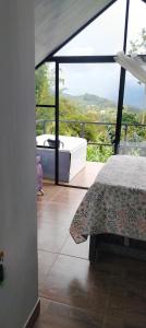 Ένα ή περισσότερα κρεβάτια σε δωμάτιο στο Café y sueños