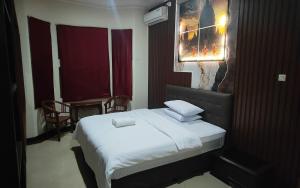 Postel nebo postele na pokoji v ubytování Omah Tirtodipuran + 36 fotografií