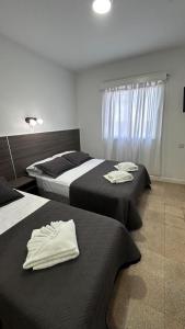 Ένα ή περισσότερα κρεβάτια σε δωμάτιο στο New Araucano +2 φωτογραφίες