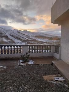 a building with a view of a snow covered field at Berber Family 