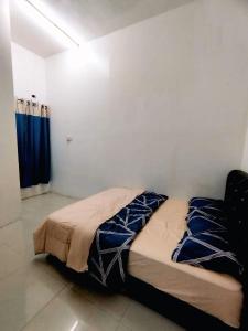 Postel nebo postele na pokoji v ubytování Me HOMESTAY Kuala Ibai, Kuala Terengganu + 3 fotografie