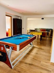 a pool table in a room with a living room at House with ocean and mountain views in Santa Susanna