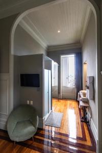 TV a/nebo společenská místnost v ubytování Casa Geranio