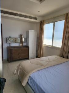 Postel nebo postele na pokoji v ubytování SeaViewApartment