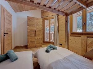 Giường trong phòng chung tại Gervonne 3