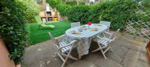 a table and chairs sitting on a patio at Casa Licia Sorso in Marina di Sorso +19 photos
