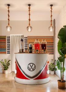 a red and white boat in a room with plants at The Square Hotel by X&N in Athens