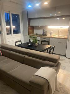 a living room with a couch and a table at Lovely place in Perea in Perea