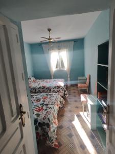 En eller flere senge i et værelse på El Andén del Hueznar