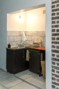 a kitchen with a sink and a counter at Mountain and Tides in Kleinmond