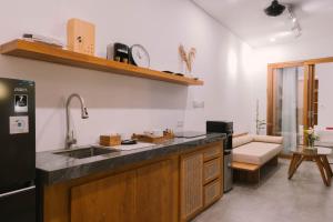 a kitchen with a sink and a counter top at 2BR Private Pool Beach Villa Near Sanur & Ubud in Ketewel