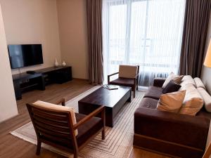 TV a/nebo společenská místnost v ubytování Voyage Hotel