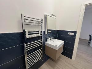 a bathroom with a sink and a mirror at Alloggio Turistico Mare Blu Gaeta in Gaeta +75 photos