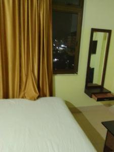 Postel nebo postele na pokoji v ubytování A Villa + 4 fotografie