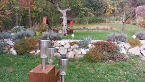 a garden with rocks and plants in a yard at Faluvégi Vendégház in Cserépváralja