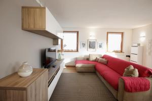 En eller flere senge i et værelse på CASA BEBA - Cavalese Olimpiadi 2026 Dolomiti Affitti