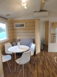 a small dining room with a table and chairs at Casa Olas y Arena el Palmar in El Palmar +11 photos