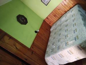 a bedroom with a bed and a wooden door at Depto San Clemente del tuyu centro in San Clemente del Tuyú +7 photos