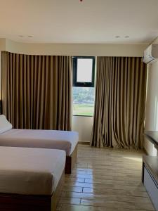 Una cama o camas en una habitación de فندق تمايا العاشر من رمضان