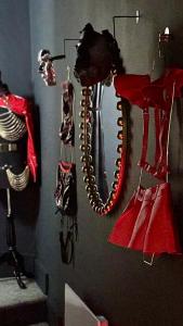 a wall with a bunch of clothes hanging on a wall at Designer Fantasy Den Boutique Seafront in Brighton & Hove