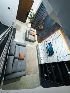 an overhead view of a living room with a couch at 3-Bedroom fully serviced terrace in Orchid, Lekki Sig4 in Lekki +6 photos
