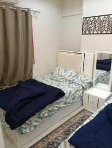 En eller flere senge i et værelse på شقة فندقية غرفة واحدة