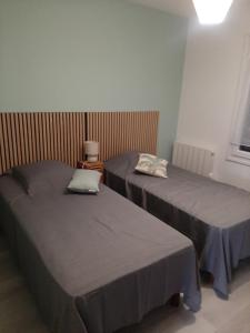 En eller flere senge i et værelse på La Maison d'à côté