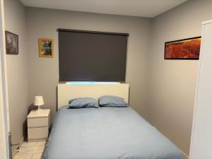 a bedroom with a bed with a large window at Casa Nueva in Las Palmas de Gran Canaria
