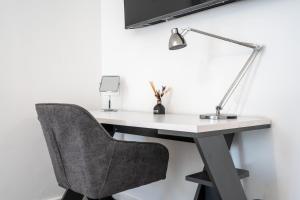 Μια τηλεόραση ή/και κέντρο ψυχαγωγίας στο Central Wembley Stadium Luxe Stay with Pool Table +62 φωτογραφίες