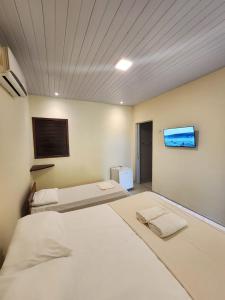 Ένα ή περισσότερα κρεβάτια σε δωμάτιο στο Pipa Villa Mar