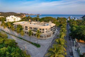 an aerial view of a building with the ocean in the background at 3077 - Solana B203 in Santa Cruz Huatulco
