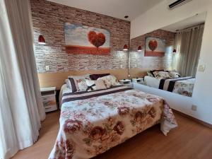 Ένα ή περισσότερα κρεβάτια σε δωμάτιο στο Alugo Flat mobiliado no Aldeia da Àguas em Barra do Piraí +25 φωτογραφίες