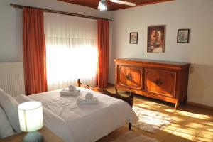 Ένα ή περισσότερα κρεβάτια σε δωμάτιο στο Giotas home near Meteora