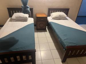 Postel nebo postele na pokoji v ubytování Hotel Greenmount