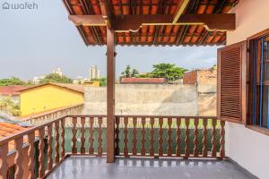 a balcony with a view of the city at Hostel Wafeh Fleming in Belo Horizonte