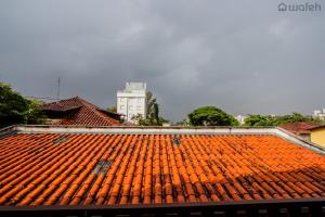 an orange tile roof on top of a building at Hostel Wafeh Fleming in Belo Horizonte