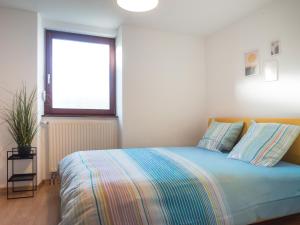 Ένα ή περισσότερα κρεβάτια σε δωμάτιο στο Résidence de 80 m2 avec grand parking - proche pistes cyclables