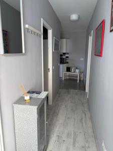 a room with a hallway with a table and a kitchen at Casa Nueva in Las Palmas de Gran Canaria