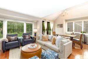 a living room with a couch and chairs and a table at Hideaway Cove in Galena